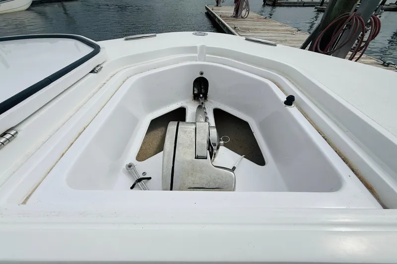 Slide: The Image of Anchor compartment of 2009 Southport 26 Center Console boat at dock. - 5