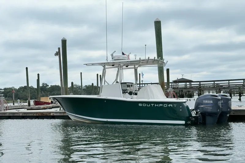 Slide: The Image of 2009 Southport 26 Center Console boat docked with twin Yamaha engines. - 6