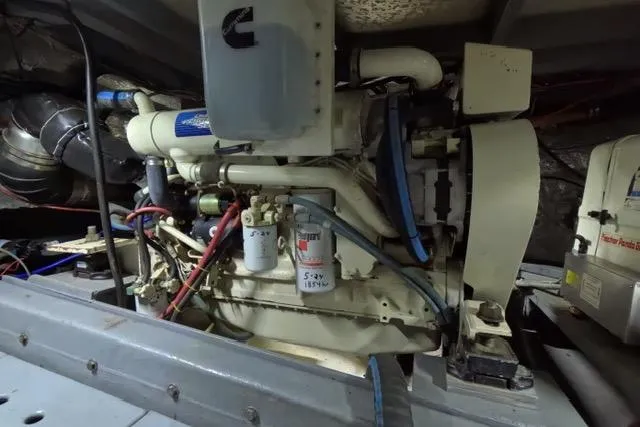 Slide: The Image of Engine room of a 1987 Californian 45 Motor Yacht, showcasing mechanical components. - 21