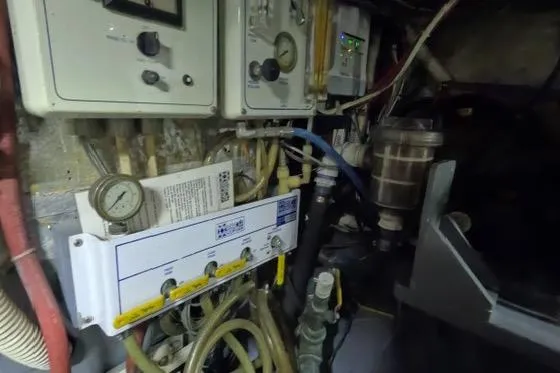 Slide: The Image of Engine room of 1987 Californian 45 Motor Yacht with gauges and control panels. - 31