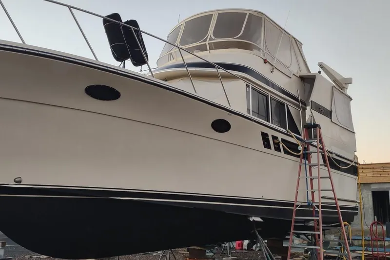 Slide: The Image of 1987 Californian 45 Motor Yacht on dry dock with ladder and maintenance equipment. - 6
