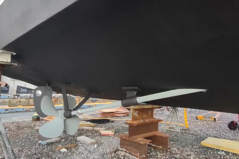 Slide: The Image of 1987 Californian 45 Motor Yacht propeller and rudder on dry dock. - 63