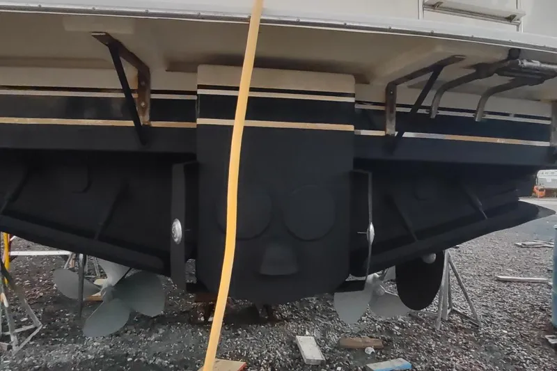 Slide: The Image of 1987 Californian 45 Motor Yacht stern view with propellers and rudders visible. - 64