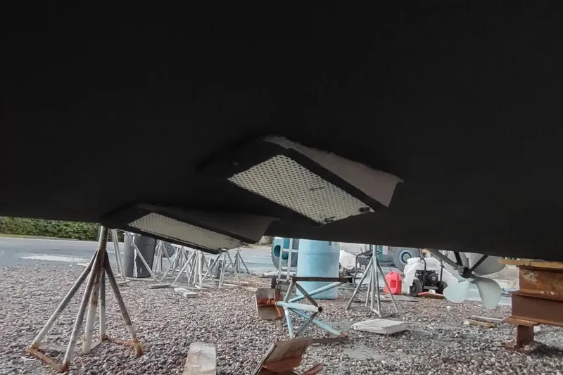 Slide: The Image of Underside of 1987 Californian 45 Motor Yacht on stands, showing hull and propeller. - 67