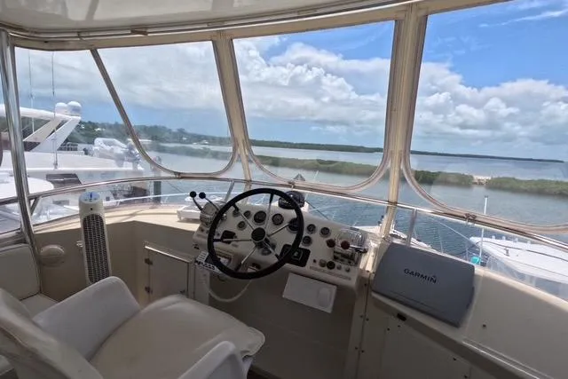 Slide: The Image of 1987 Californian 45 Motor Yacht helm with panoramic water view and navigation equipment. - 9