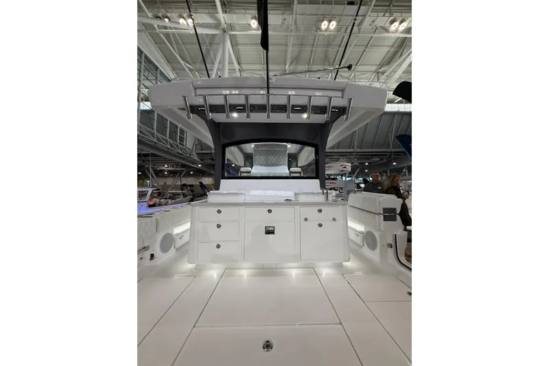 Slide: The Image of 2026 HCB 48 Campeon boat interior with sleek white cabinetry and modern design. - 10