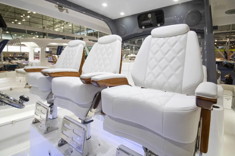 Slide: The Image of Luxurious white seating on 2026 HCB 48 Campeon boat, featuring elegant design and craftsmanship. - 2