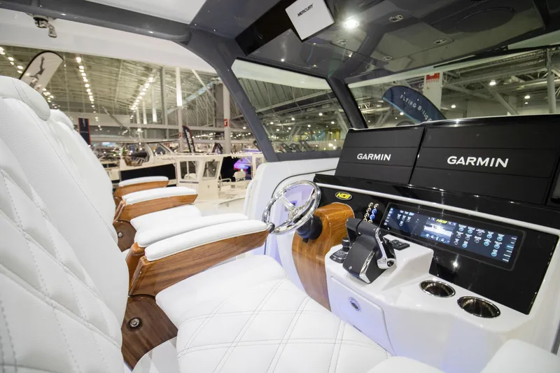 Slide: The Image of Luxurious interior of 2026 HCB 48 Campeon boat with advanced Garmin navigation system. - 3