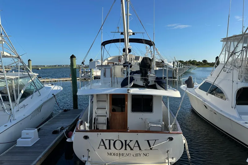 Slide: The Image of Docked 1999 Kadey-Krogen 39 yacht among other boats in a marina. - 2