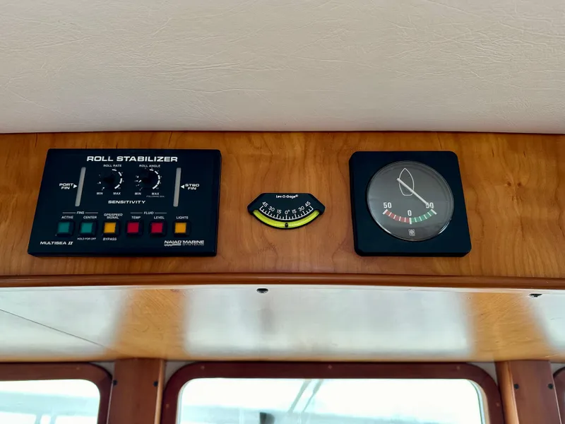 Slide: The Image of Control panel of a 1999 Kadey-Krogen 39 yacht with roll stabilizer and gauge. - 23