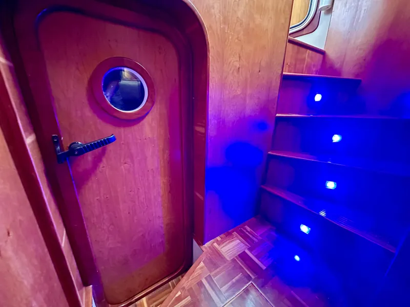 Slide: The Image of Wooden cabinet with blue CleverMade crates inside a 1999 Kadey-Krogen 39 boat. - 26