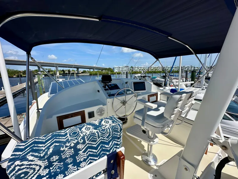 Slide: The Image of Engine room of a 1999 Kadey-Krogen 39 yacht, showcasing detailed machinery components. - 33