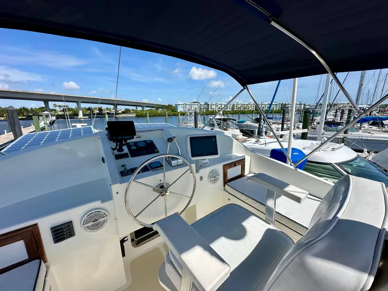 Slide: The Image of Engine room of a 1999 Kadey-Krogen 39 boat, showcasing mechanical components. - 34