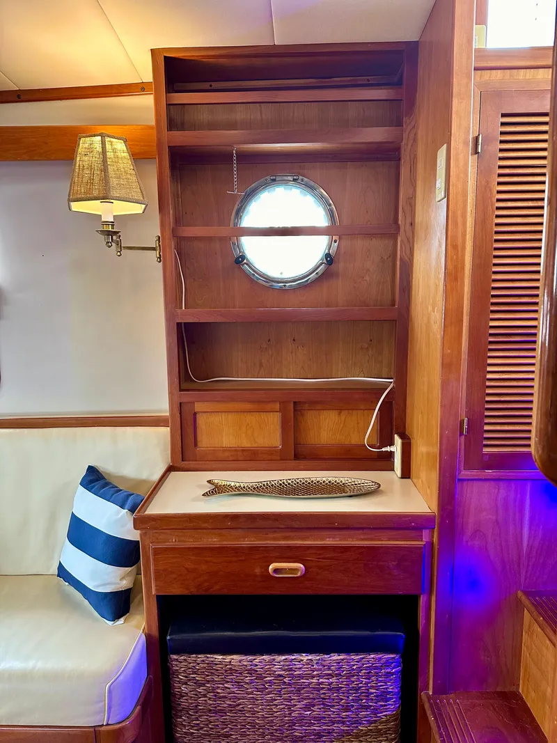 Slide: The Image of Cozy 1999 Kadey-Krogen 39 yacht kitchen with wood cabinetry, sink, stove, and refrigerator. - 9