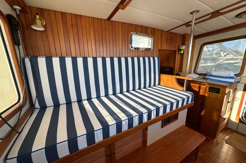 Slide: The Image of Pilothouse of 1999 Kadey-Krogen 39 yacht with wooden helm and Garmin navigation. - 15