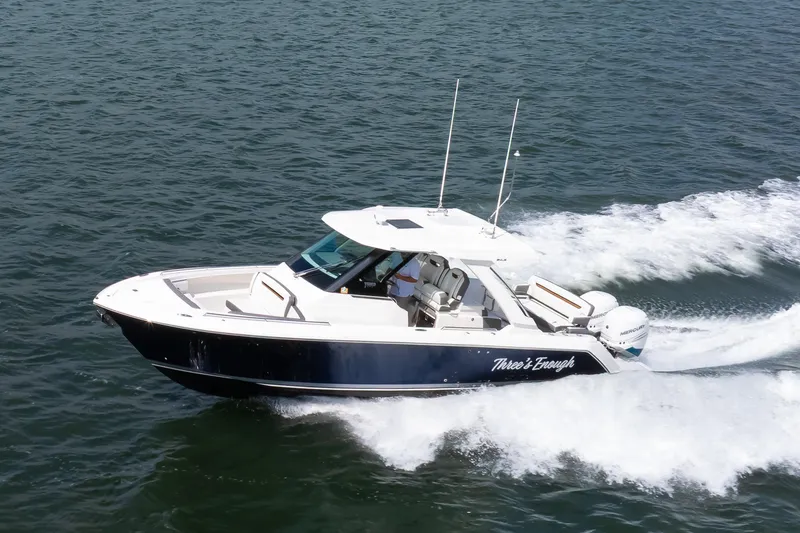 The Image of 2020 Tiara Sport 34 LS boat cruising on open water. - 0