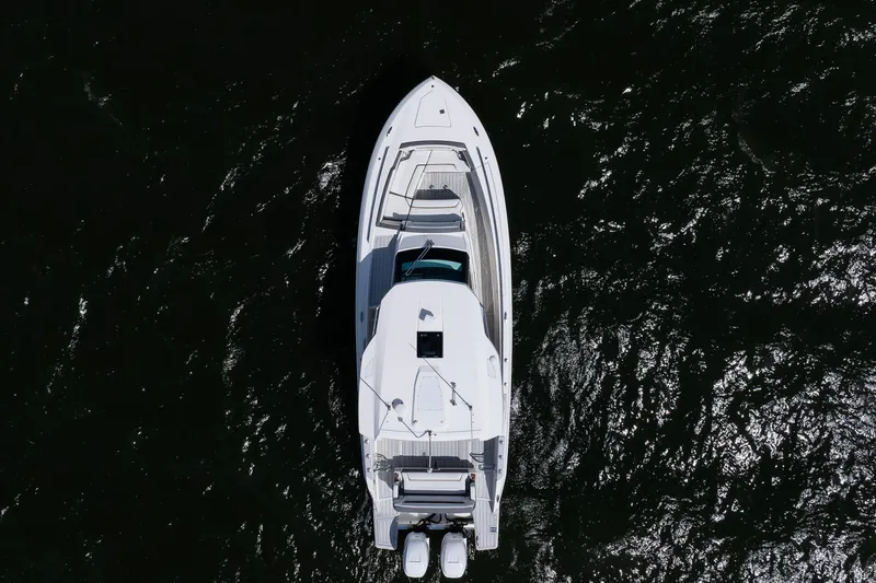 Slide: The Image of Overhead view of 2020 Tiara Sport 34 LS boat on dark water. - 13