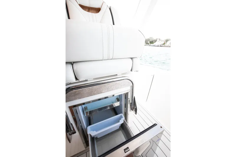 Slide: The Image of 2020 Tiara Sport 34 LS yacht interior with open storage compartment. - 22