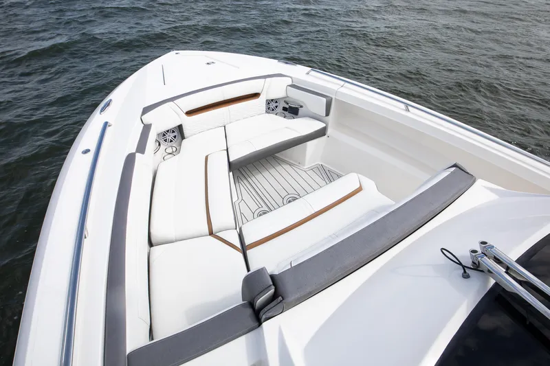 Slide: The Image of 2020 Tiara Sport 34 LS boat interior with white seating and ocean view. - 23