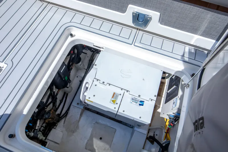 Slide: The Image of Engine compartment of 2020 Tiara Sport 34 LS boat, showcasing mechanical components and wiring. - 29