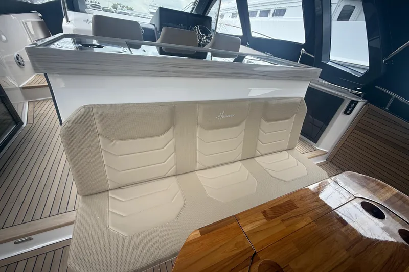 Slide: The Image of Luxurious interior of 2025 Hanover 447 yacht with elegant seating and wooden table. - 38