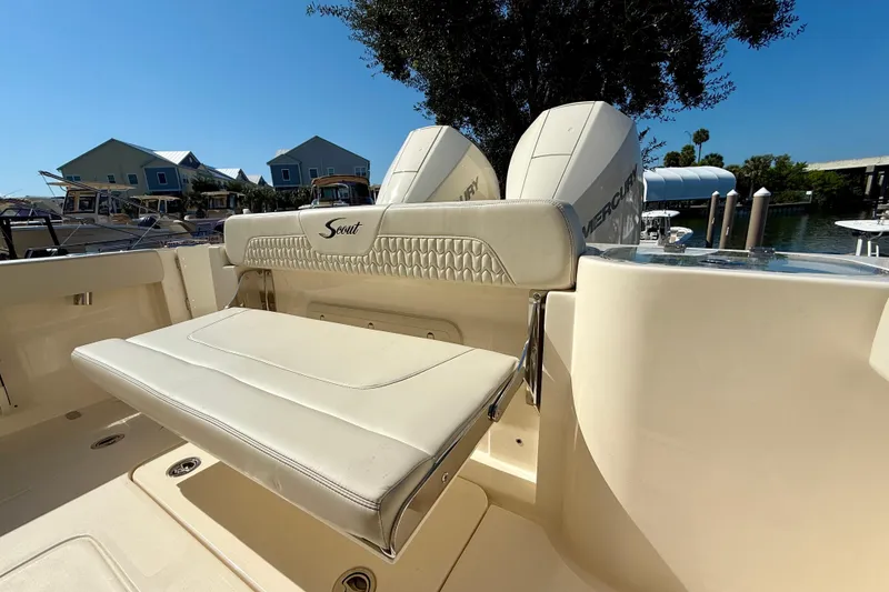 Slide: The Image of 2026 Scout 260 LXF boat with comfortable seating and dual Mercury engines. - 10