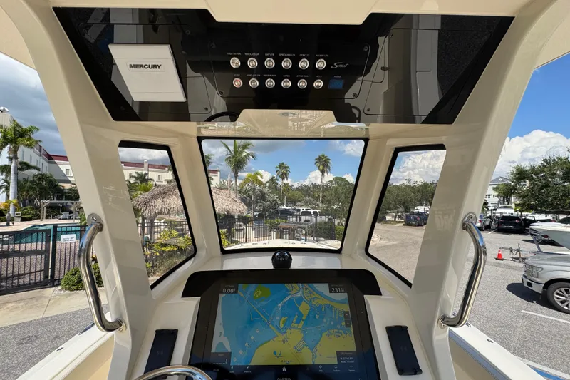 Slide: The Image of Interior view of 2026 Scout 260 LXF boat cockpit with navigation display and controls. - 17