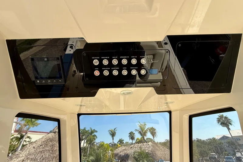 Slide: The Image of Interior view of 2026 Scout 260 LXF boat dashboard with control panel and display. - 20