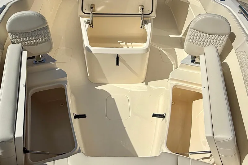 Slide: The Image of 2026 Scout 260 LXF boat interior with seating and storage compartments. - 24