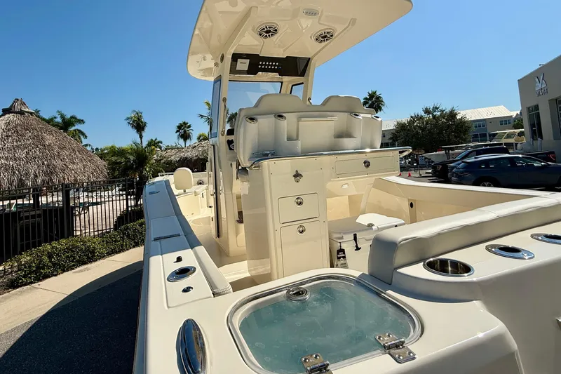 Slide: The Image of 2026 Scout 260 LXF boat with sleek design, spacious deck, and modern amenities. - 5