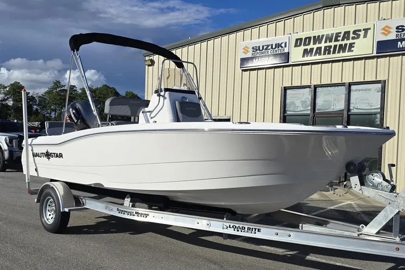 The Image of 2026 NauticStar 191 Hybrid boat on trailer at Downeast Marine dealership. - 1