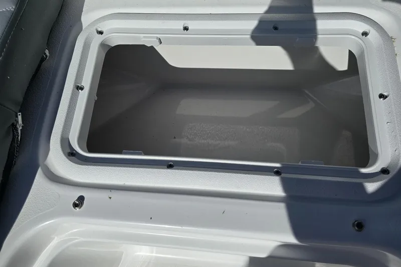 Slide: The Image of Open storage compartment on 2026 NauticStar 191 Hybrid boat. - 14