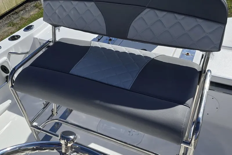 Slide: The Image of 2026 NauticStar 191 Hybrid boat seat with quilted gray upholstery and stainless steel frame. - 5