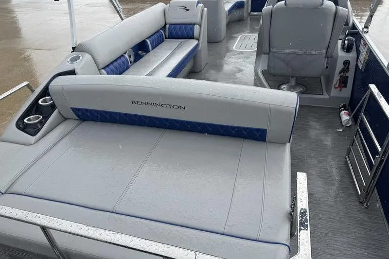 Slide: The Image of 2022 Bennington 26 LXSB boat interior with gray and blue seating. - 14