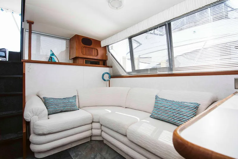 Slide: The Image of Interior of 1991 Carver 36 Aft Cabin Motor Yacht with cozy dining area. - 10
