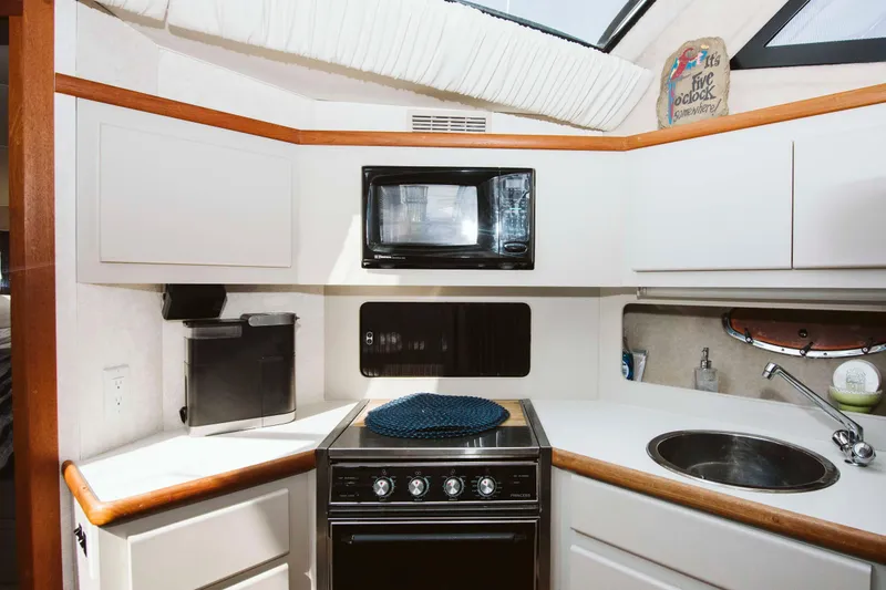 Slide: The Image of Bathroom interior of 1991 Carver 36 Aft Cabin Motor Yacht with sink and amenities. - 12