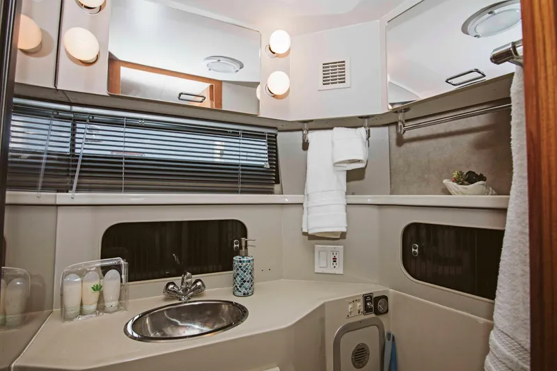 Slide: The Image of 1991 Carver 36 Aft Cabin Motor Yacht bedroom with cozy bed and wooden interior. - 13