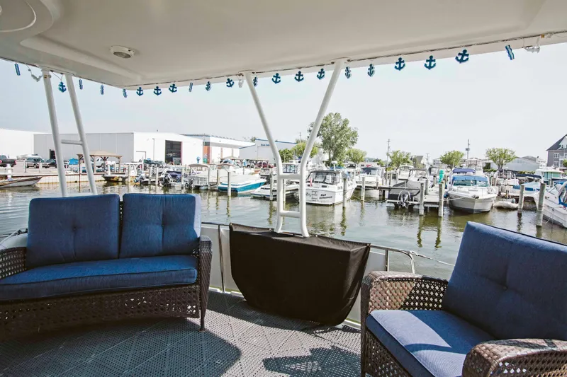 Slide: The Image of Interior of 1991 Carver 36 Aft Cabin Motor Yacht with dining area and stairs. - 3