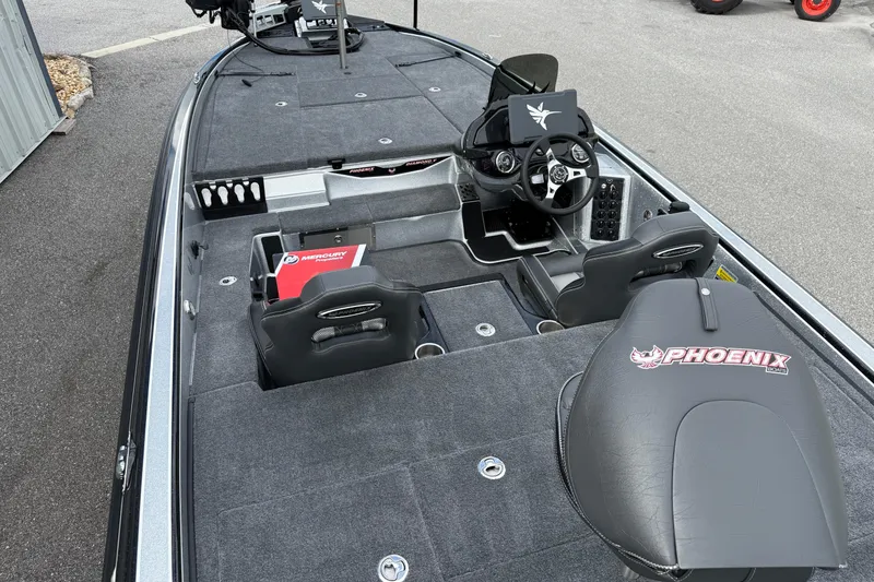 Slide: The Image of 2026 Phoenix 920 ELITE X II boat interior with dual seats and Mercury box. - 10