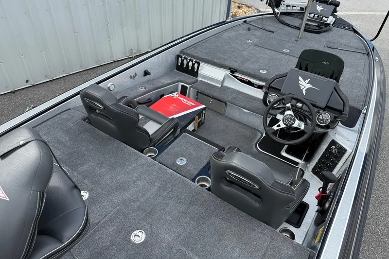 Slide: The Image of 2026 Phoenix 920 ELITE X II boat interior with steering console and seating. - 11