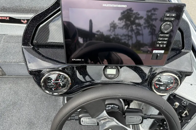 Slide: The Image of 2026 Phoenix 920 ELITE X II boat interior with steering wheel and control panel. - 13