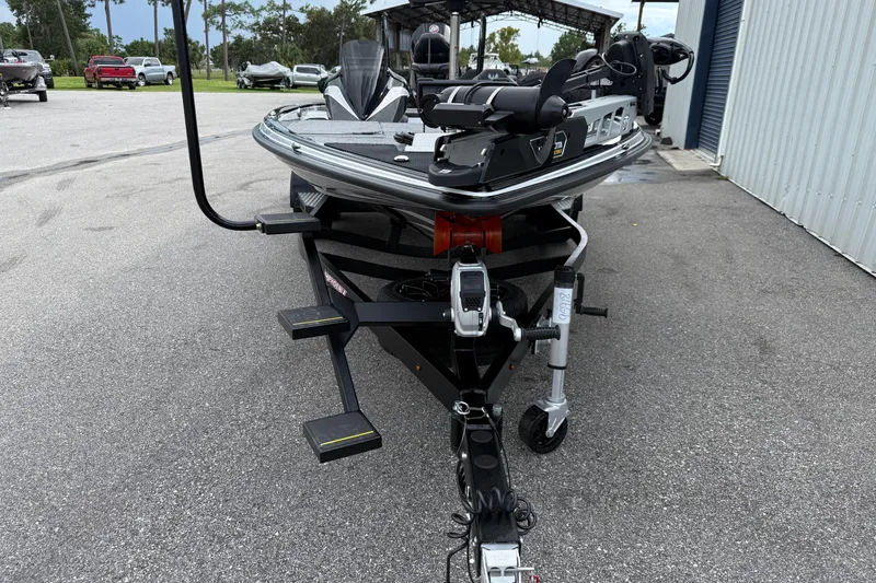 Slide: The Image of 2026 Phoenix 920 Elite X II boat with sleek design and chrome wheels. - 2