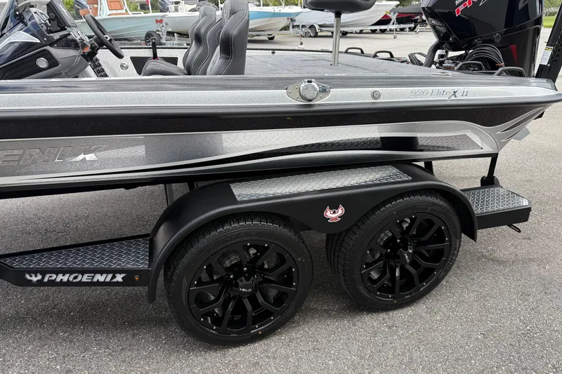 Slide: The Image of 2026 Phoenix 920 Elite X II boat on trailer in parking lot. - 4