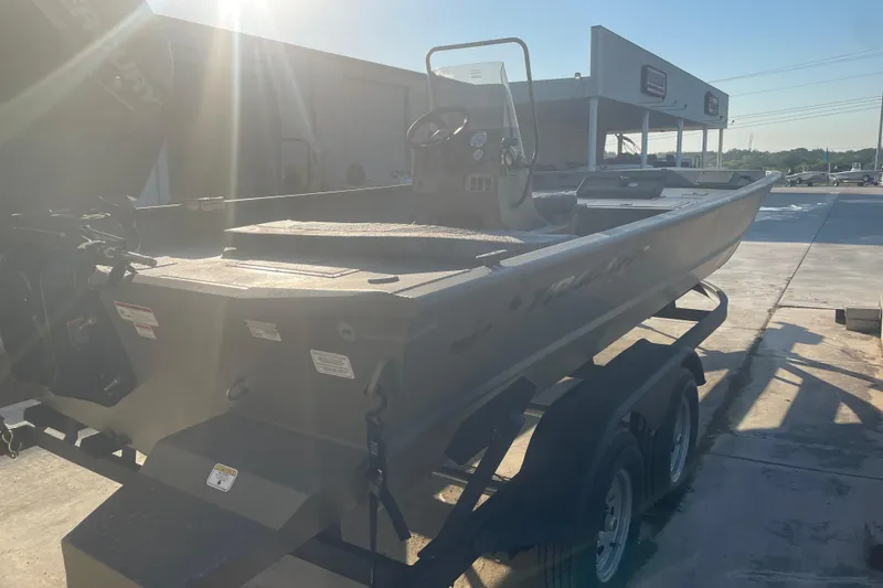 Slide: The Image of 2026 Tracker Grizzly 2072 CC boat on trailer in sunny outdoor setting. - 3