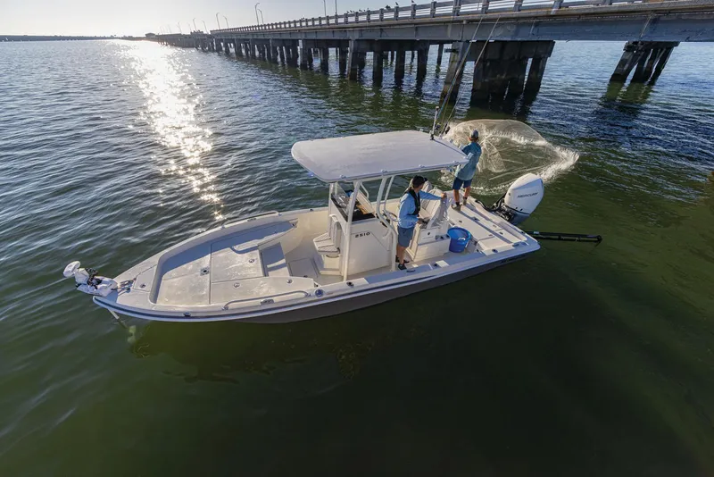 Slide: The Image of 2025 Ranger 2510 Bay boat on trailer, parked outdoors under clear sky. - 4