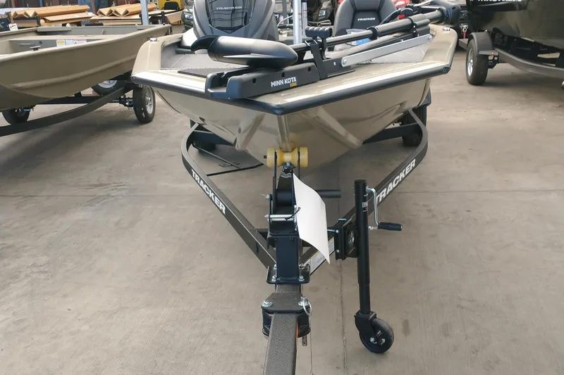 Slide: The Image of 2026 Tracker Pro Team 175 boat on trailer in showroom. - 2