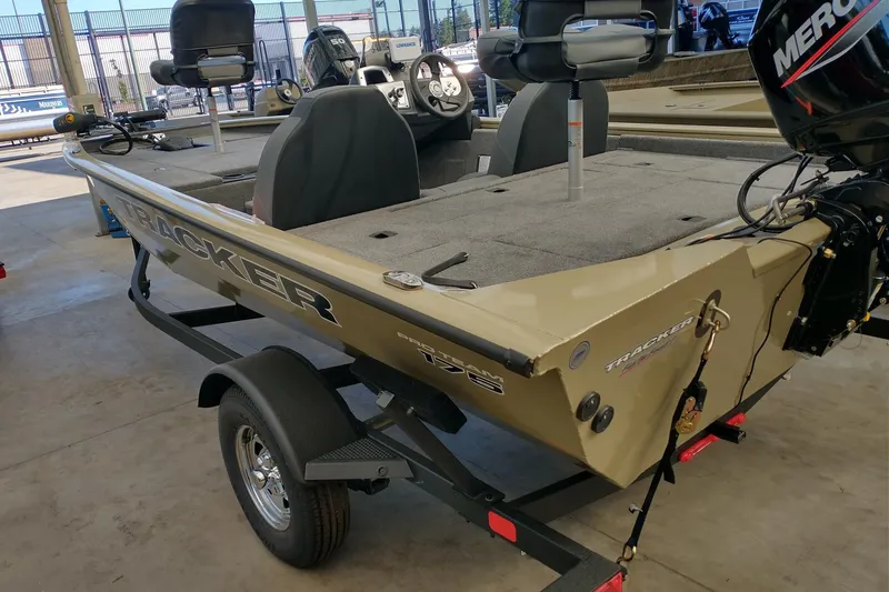 Slide: The Image of 2026 Tracker Pro Team 175 boat on trailer in showroom. - 4
