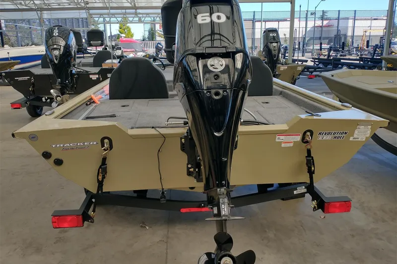 Slide: The Image of 2026 Tracker Pro Team 175 boat with 60 HP engine in showroom. - 5