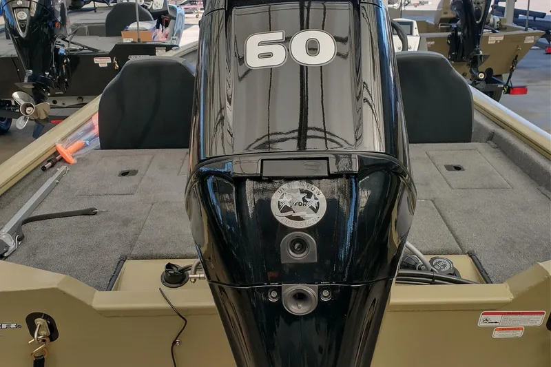 Slide: The Image of 2026 Tracker Pro Team 175 boat with a 60 HP outboard motor, interior view. - 6