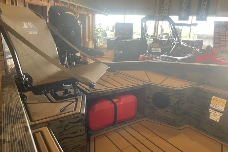 Slide: The Image of 2026 Tracker Grizzly 1650 T Prairie Wings Edition boat interior with seating and storage. - 6